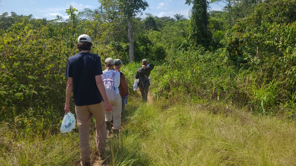 People walking through a peaceful ayahuasca retreat setting in Peru